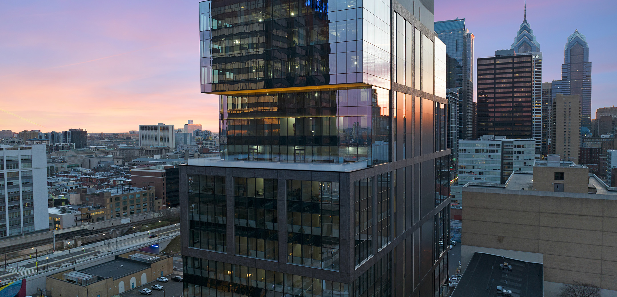 A close up view of the exterior of 2222 Market Street featuring an outdoor porch terrace