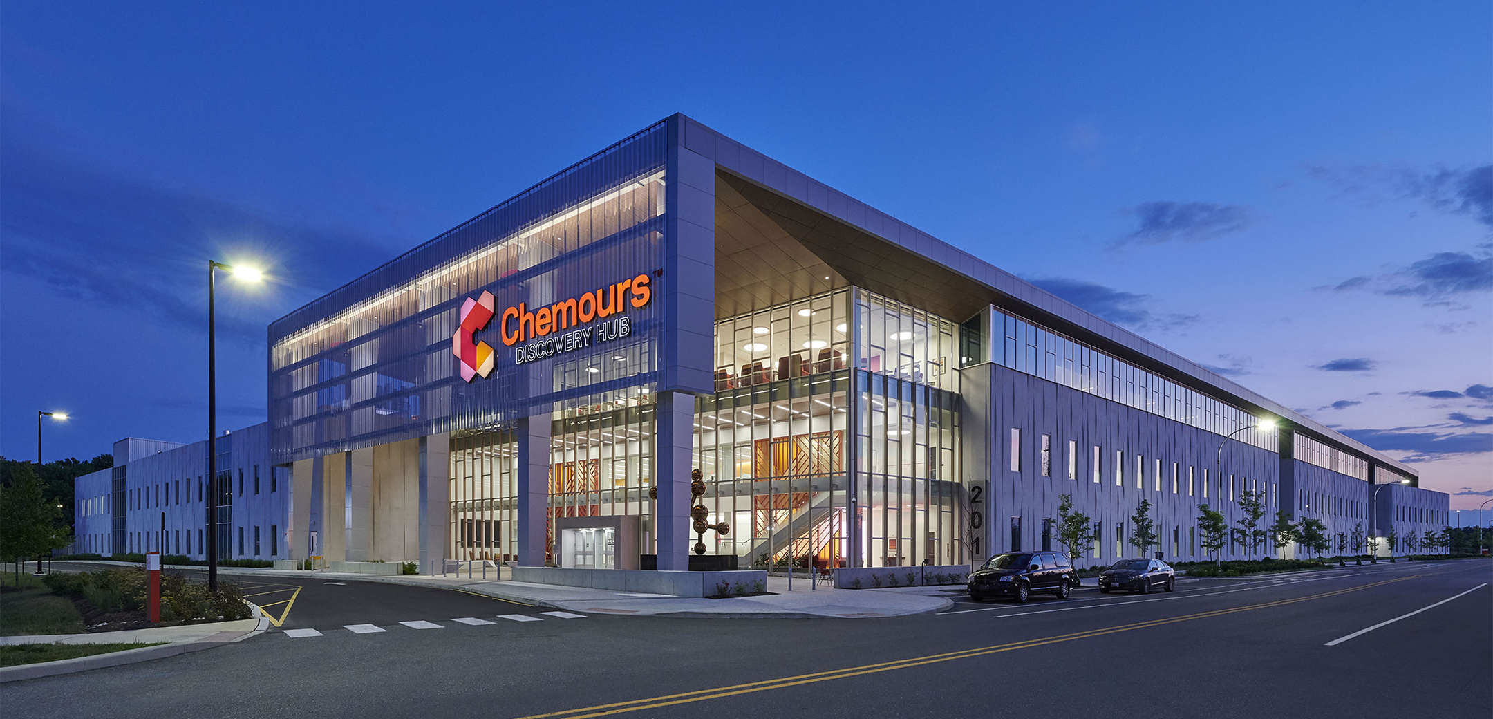 Nightime photo showing the exterior of Chemours Discovery Hub, commercial and science & technology project in Newark, DE.