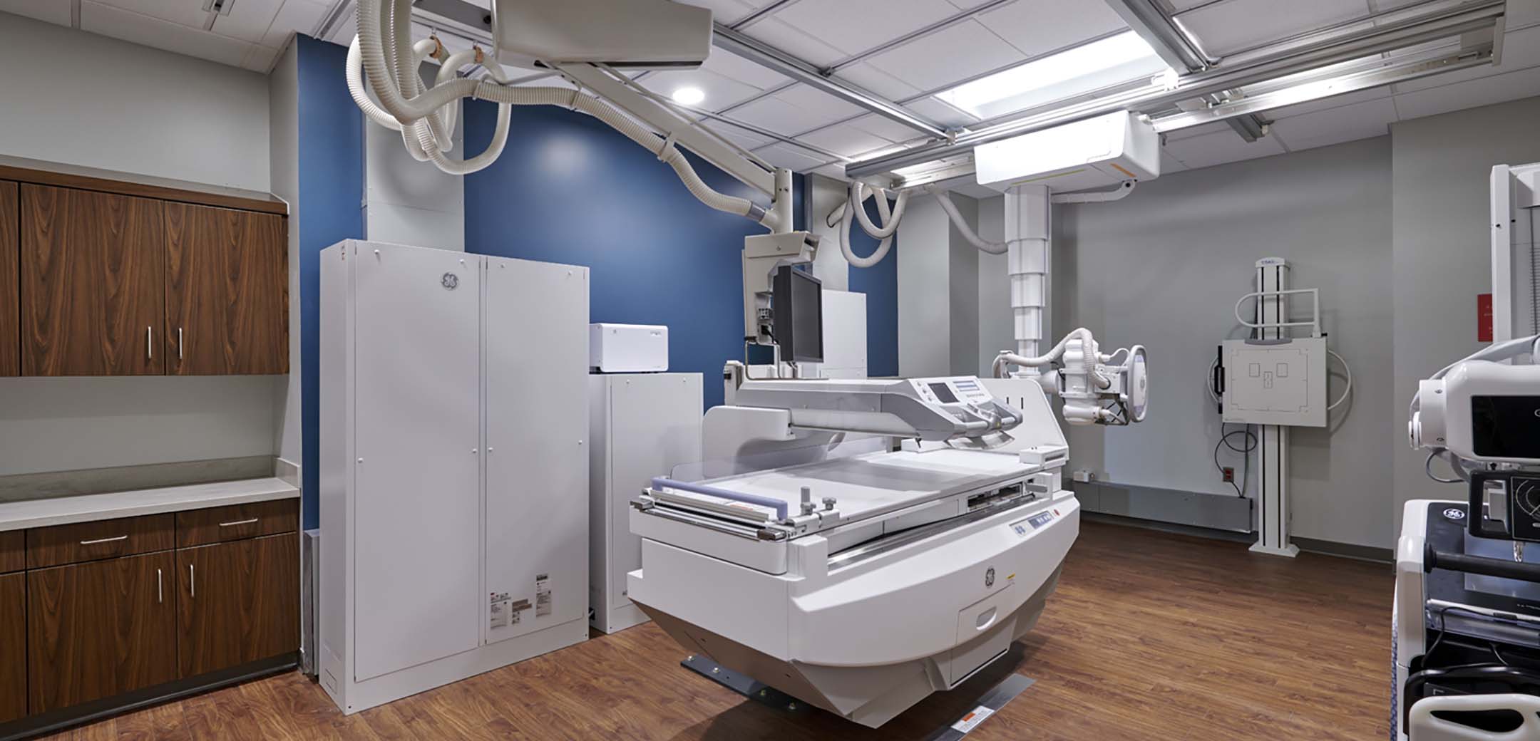 A close up of the St. Luke's Carbon County X-ray room showcasing the different standing and laying x-ray machine equipment.