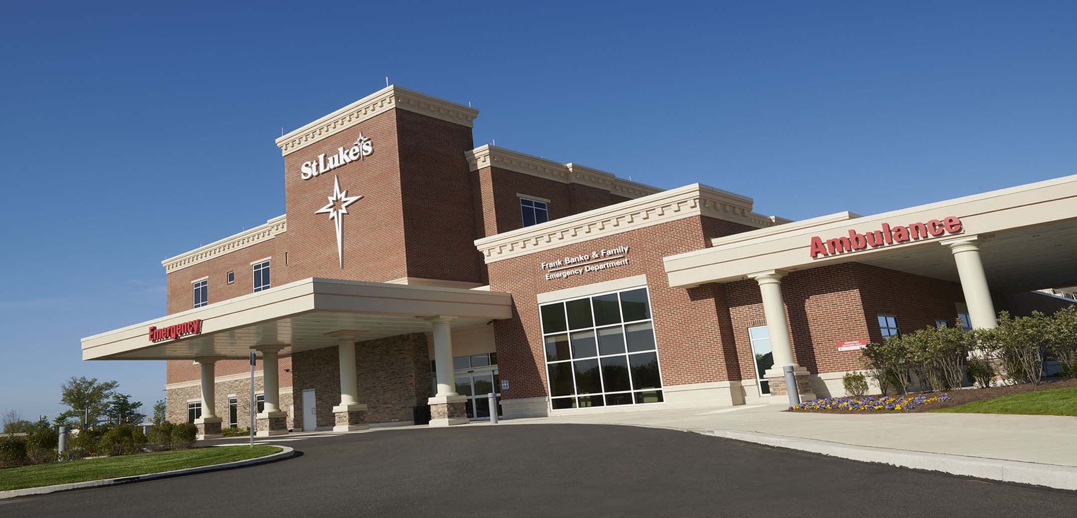 SA close up image of the St Luke`s Quartertown red brick building showcasing the Emergency ambulance driveway and entrance.