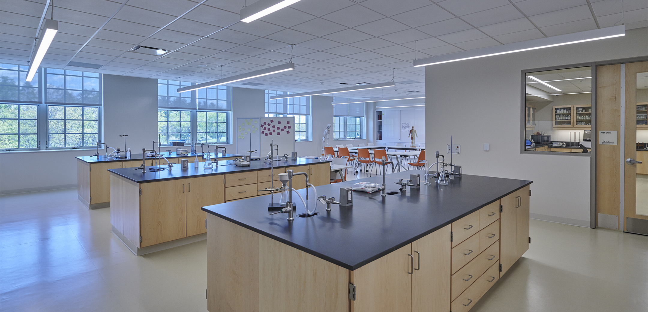 An interior view of the Malvern Prep school lab featuring clean white walls, flooring and lab faucets and equipment.