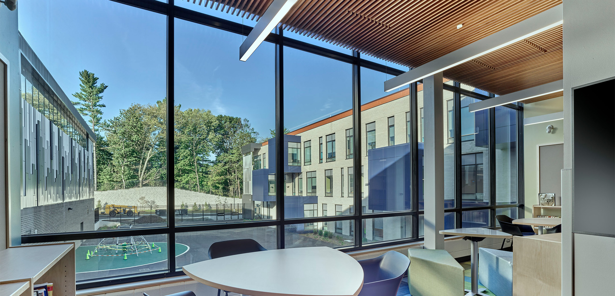 The interior of Black Rock Middle School featuring a large window showing the outside playground