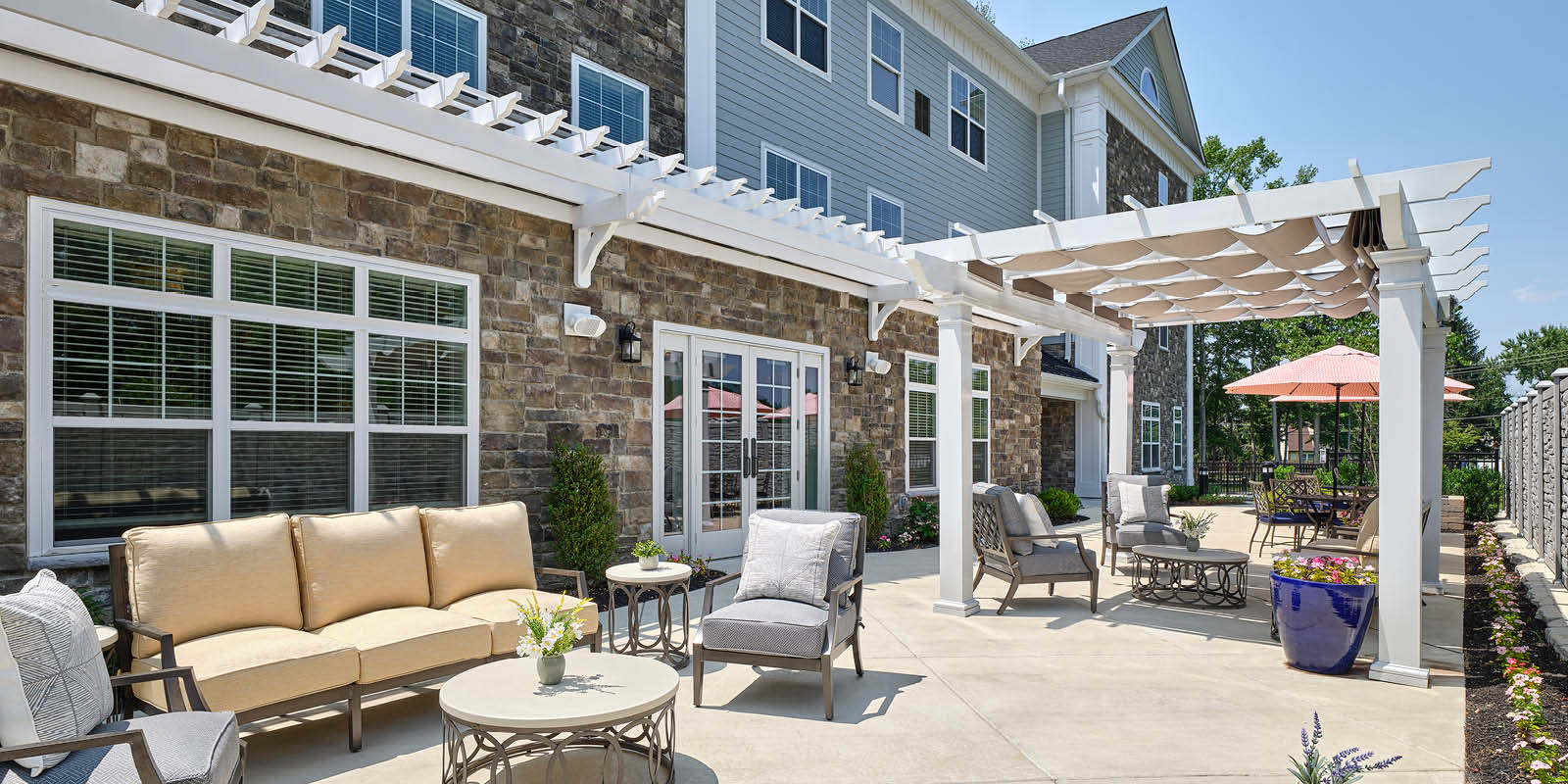Senior Living facility's courtyard amenities with chairs and tables