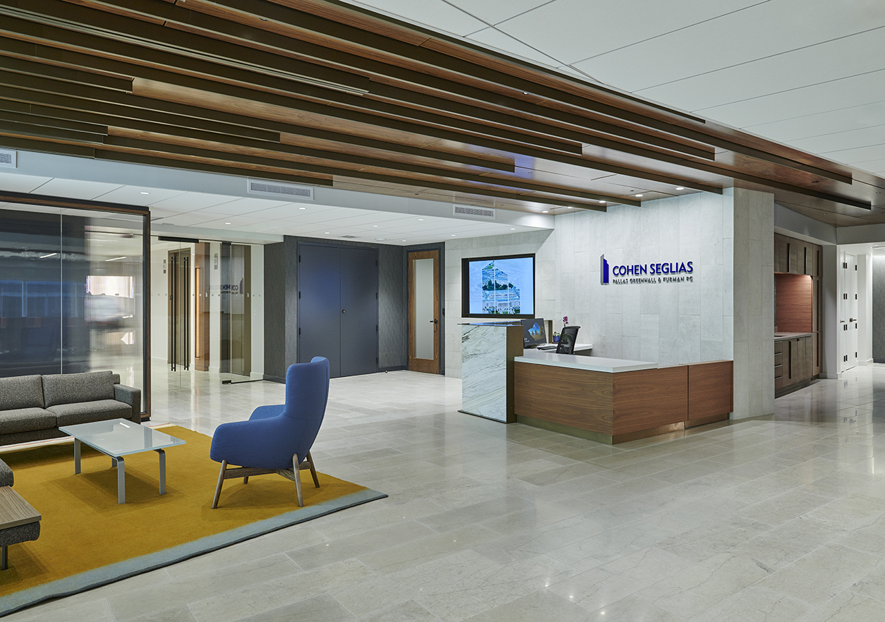 The interior lobby of Cohen Seglias with a front desk and furniture.