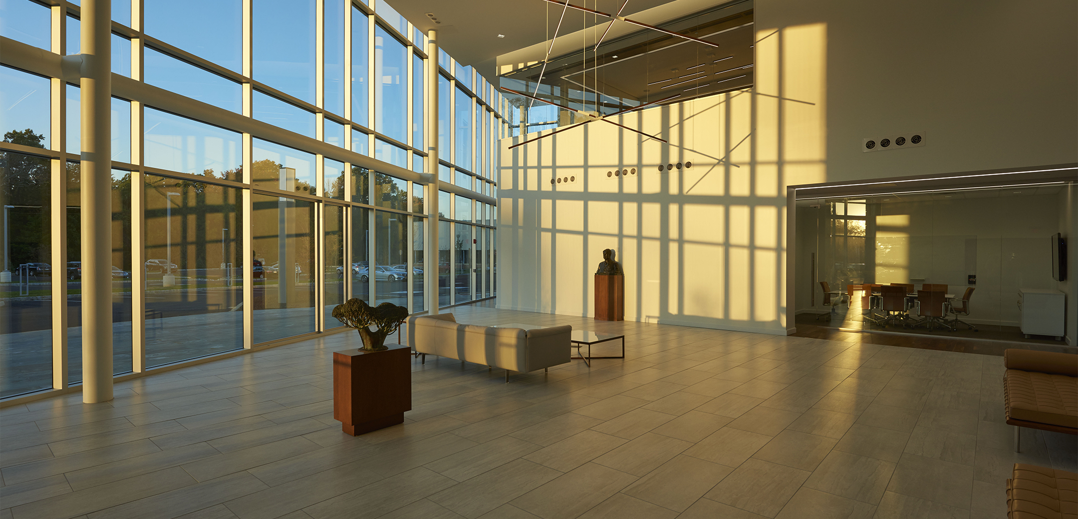 The interior lobby of Sunoco headquarters featuring large windows and open concept lobby with a view to the front of the building.