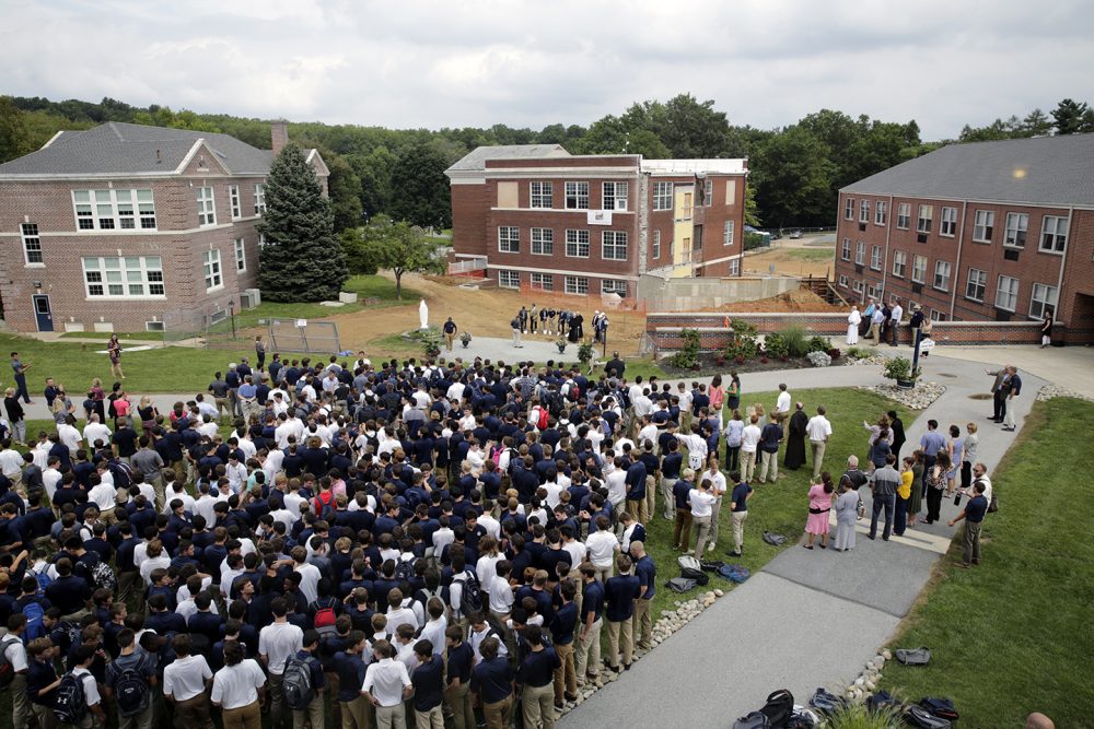 An aerial view of dozens of students at the ground breaking ceremony for the new Malvern Prep Center for Social Impact building.