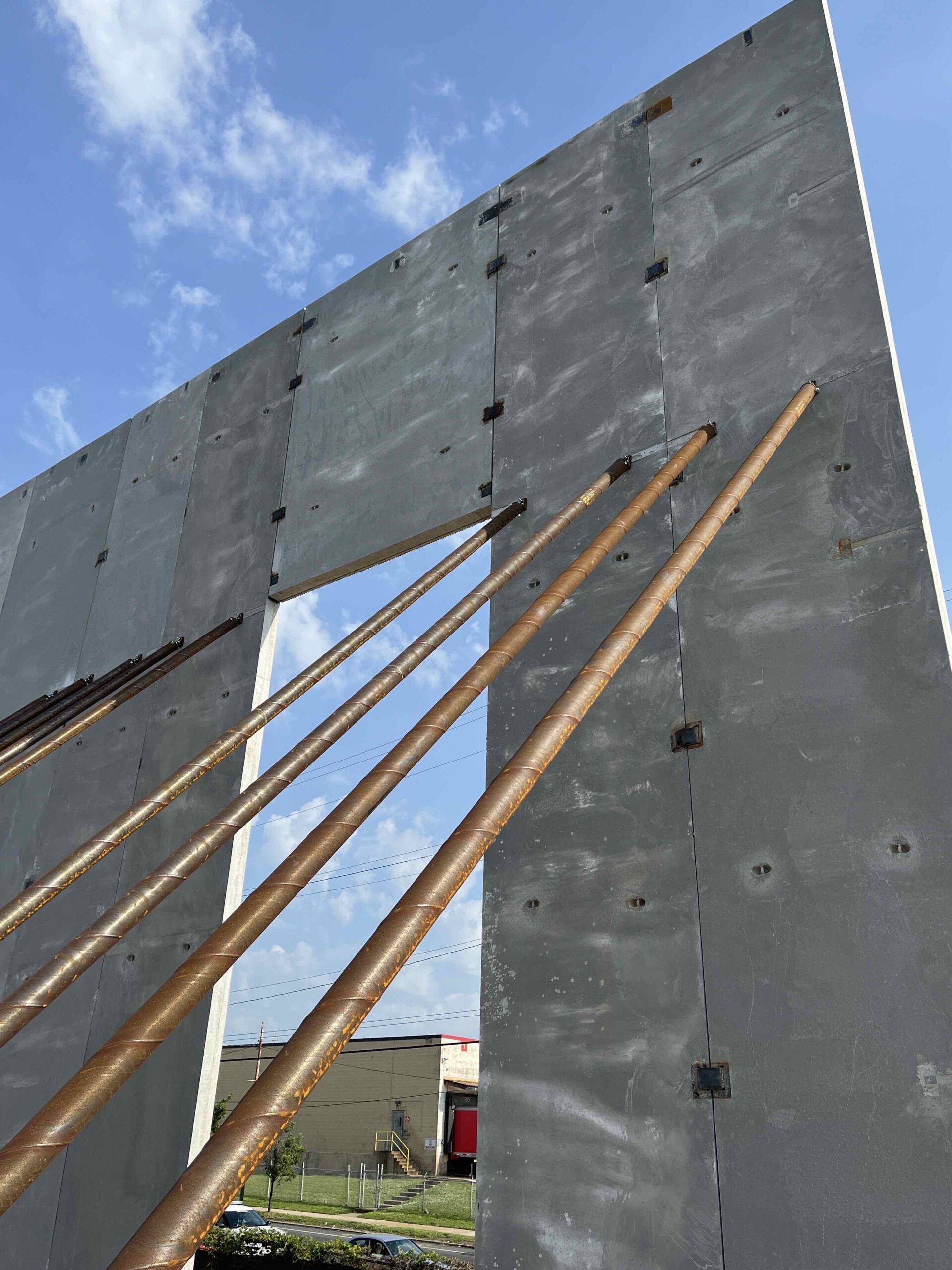 Tilt-up panels being installed at Crown 95 Logistics Center with blue sky in background