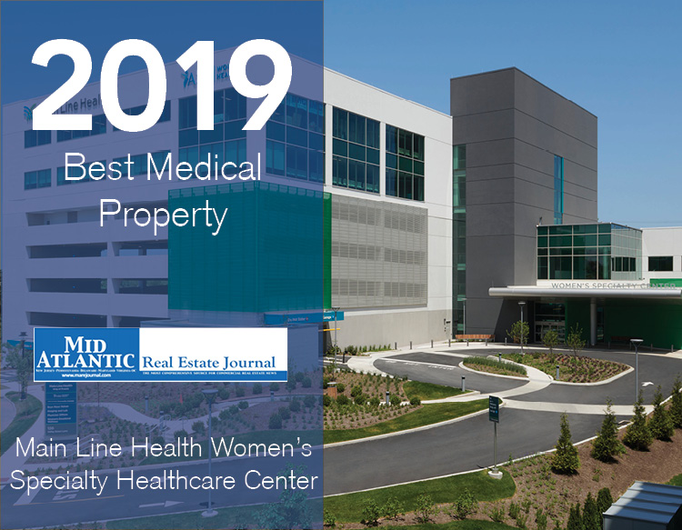 An awards graphic featuring the 2019 Best Medical Property, MAREJ logo placed on a half blue tinted image of Main Line Health Women`s Specialty Healthcare Center.