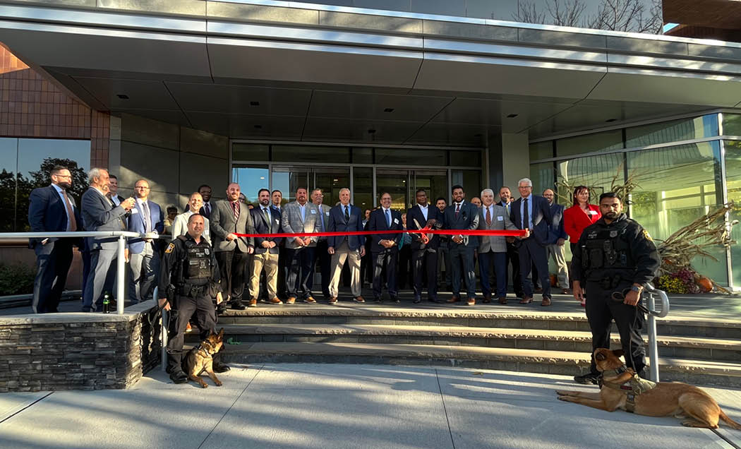 A group photo of various people at the grand opening of IMC`s new office in Edison, NJ